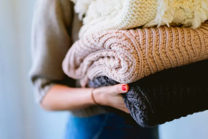 Commercial Cleaning Services in Edmonton person holding knitted textiles
